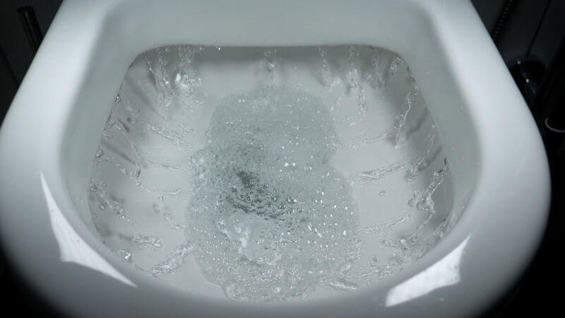 Close up of the water flushing in a toilet